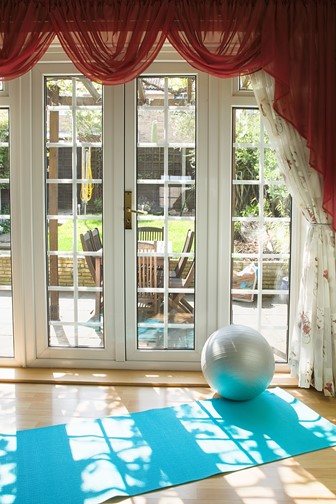 home gym with exercise mat and rubber gym ball