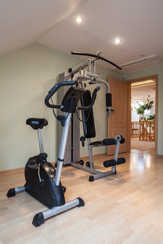 gym equipment in a large, modern house